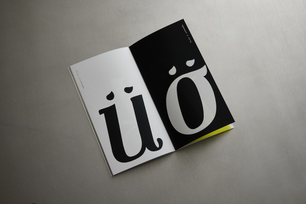 nahaufnahmen der buchstaben ü und ö, das ü ist auf schwarzem hintergrund und das ö auf weißem